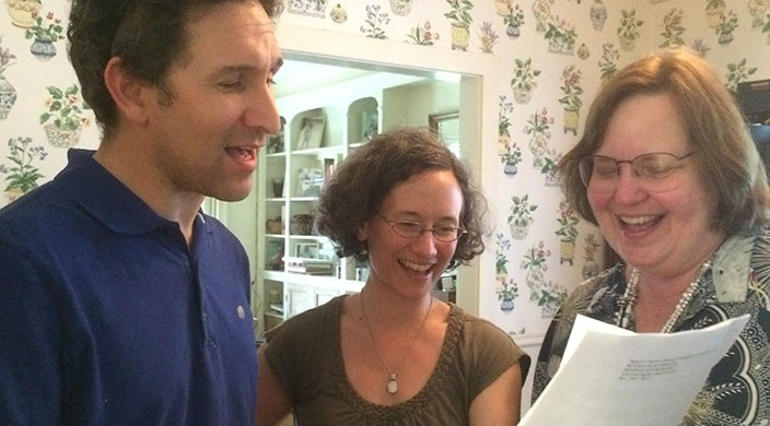 Three members of the author's family singing a song from one of her plays at their seder